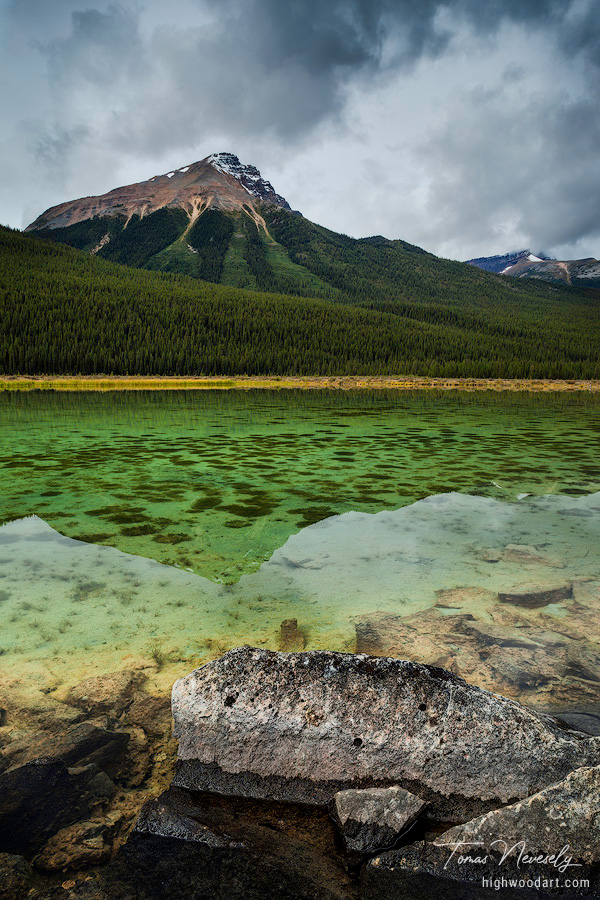 A Mountain reflecting in a lake in Jasper National Park, Alberta, Canada